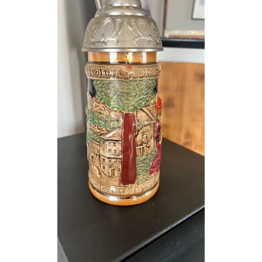 Vintage German musical beer stein,  embossed painted scenes, hinged pewter lid